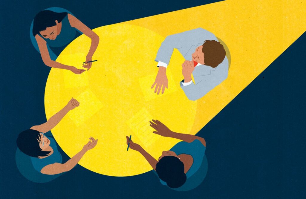 Illustration of a diverse group of people collaborating around a table under a spotlight, representing collective decision-making, facilitation, and inclusive strategy.